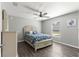 Bedroom with a queen-size bed, dresser, and tile flooring at 5615 Nw 202Nd Pl, Mc Intosh, FL 32664