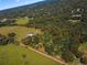 Aerial view of property with house and large lot at 5615 Nw 202Nd Pl, Mc Intosh, FL 32664