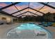 Inviting pool and screened enclosure, perfect for relaxation and entertainment at 5615 Nw 202Nd Pl, Mc Intosh, FL 32664