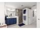 Bathroom with a walk-in shower, dual vanities, and access to other rooms at 5615 Nw 202Nd Pl, Mc Intosh, FL 32664