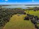 Expansive property with a home situated near a lake at 5615 Nw 202Nd Pl, Mc Intosh, FL 32664