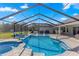Stunning screened pool and spa with ample lounge space at 5615 Nw 202Nd Pl, Mc Intosh, FL 32664