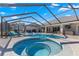Luxury screened pool and spa with plenty of seating at 5615 Nw 202Nd Pl, Mc Intosh, FL 32664