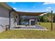Pool equipment with shade sail and exterior wall at 5615 Nw 202Nd Pl, Mc Intosh, FL 32664
