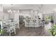 Open concept kitchen with island seating and dining area at 5615 Nw 202Nd Pl, Mc Intosh, FL 32664