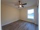 Bright bedroom with ceiling fan and wood-look flooring at 41 Pecan Pass Trl, Ocala, FL 34472