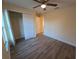 Spacious bedroom with walk-in closet and wood-look flooring at 41 Pecan Pass Trl, Ocala, FL 34472