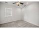 Simple bedroom with ceiling fan and neutral wall paint at 8546 Sw 79Th Ave, Ocala, FL 34476