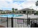 Relaxing community pool with plenty of lounge chairs and umbrellas at 8546 Sw 79Th Ave, Ocala, FL 34476