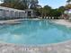 Community pool with surrounding lounge chairs at 8546 Sw 79Th Ave, Ocala, FL 34476