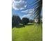 Backyard with grassy area and palm trees at 5858 Nw 27Th Pl, Ocala, FL 34482
