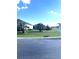 Large grassy area with palm trees and street view at 5858 Nw 27Th Pl, Ocala, FL 34482