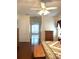 Main bedroom with wood floors and en-suite bathroom access at 5858 Nw 27Th Pl, Ocala, FL 34482