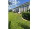 House exterior with sunroom and manicured lawn at 5858 Nw 27Th Pl, Ocala, FL 34482