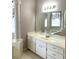 Bathroom with double vanity, large mirror, and lots of light at 5858 Nw 27Th Pl, Ocala, FL 34482