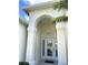 Elegant entryway with arched doorway and decorative light fixture at 5858 Nw 27Th Pl, Ocala, FL 34482