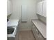Laundry room with washer, dryer and cabinets at 5858 Nw 27Th Pl, Ocala, FL 34482