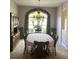 Formal dining room with wood table and chairs, large window at 5858 Nw 27Th Pl, Ocala, FL 34482