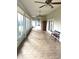 Sunroom with tile floors and ceiling fans at 5858 Nw 27Th Pl, Ocala, FL 34482