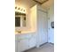 Bathroom with vanity, mirror and shower at 5858 Nw 27Th Pl, Ocala, FL 34482