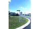 Residential street view with green lawns and homes at 5858 Nw 27Th Pl, Ocala, FL 34482