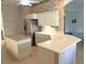 Kitchen with large island, white cabinets, and stainless steel appliances at 5858 Nw 27Th Pl, Ocala, FL 34482