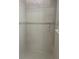 Clean shower with tiled walls and a built-in shelf at 5858 Nw 27Th Pl, Ocala, FL 34482