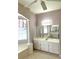 Large bathroom with double vanity and a large mirror at 5858 Nw 27Th Pl, Ocala, FL 34482