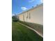 Exterior view of house with hedges and lawn at 5858 Nw 27Th Pl, Ocala, FL 34482