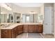 Primary bathroom with a large vanity, double sinks, and a walk-in shower at 8445 Sw 93Rd Cir, Ocala, FL 34481