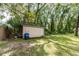 Small storage shed in backyard with wheelbarrow at 5456 Nw 64Th St, Ocala, FL 34482