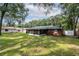 Large backyard with screened porch and mature trees at 5456 Nw 64Th St, Ocala, FL 34482