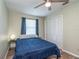 Bright bedroom with a double bed, window, and built-in closet at 5456 Nw 64Th St, Ocala, FL 34482
