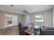 Living room with seating, coffee table, and view into under-renovation room at 5456 Nw 64Th St, Ocala, FL 34482