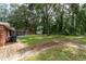 Spacious backyard with lush grass and a screened patio at 5456 Nw 64Th St, Ocala, FL 34482