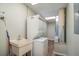 Stackable washer and dryer in a compact laundry room at 5456 Nw 64Th St, Ocala, FL 34482
