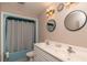 Bathroom with double vanity, shower/tub combo, and updated fixtures at 5456 Nw 64Th St, Ocala, FL 34482