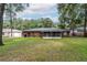 Large backyard with screened porch and mature trees at 5456 Nw 64Th St, Ocala, FL 34482