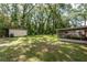 Large backyard with storage shed and screened porch at 5456 Nw 64Th St, Ocala, FL 34482