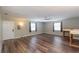 Spacious living room featuring wood-look flooring and lots of natural light at 5456 Nw 64Th St, Ocala, FL 34482