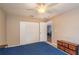 Bedroom with a queen bed, dresser and ceiling fan at 5456 Nw 64Th St, Ocala, FL 34482