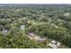 High-angle view of a residential neighborhood, with houses nestled amongst lush greenery at 5456 Nw 64Th St, Ocala, FL 34482