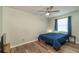 Second bedroom with wood-look flooring and a ceiling fan at 5456 Nw 64Th St, Ocala, FL 34482