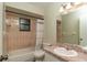 Updated bathroom with a tub and a granite countertop at 5456 Nw 64Th St, Ocala, FL 34482