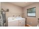 Laundry room with washer, dryer, and storage at 5456 Nw 64Th St, Ocala, FL 34482