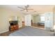 Main bedroom with a large mirror and an ensuite bathroom at 5456 Nw 64Th St, Ocala, FL 34482