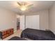 Bedroom with twin beds, dresser, and ceiling fan at 5456 Nw 64Th St, Ocala, FL 34482