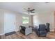 Living room with comfy seating, a coffee table, and ceiling fan at 5456 Nw 64Th St, Ocala, FL 34482