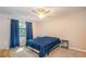 Bedroom with a queen bed and ceiling fan at 5456 Nw 64Th St, Ocala, FL 34482