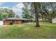 Large backyard with screened porch and mature trees at 5456 Nw 64Th St, Ocala, FL 34482